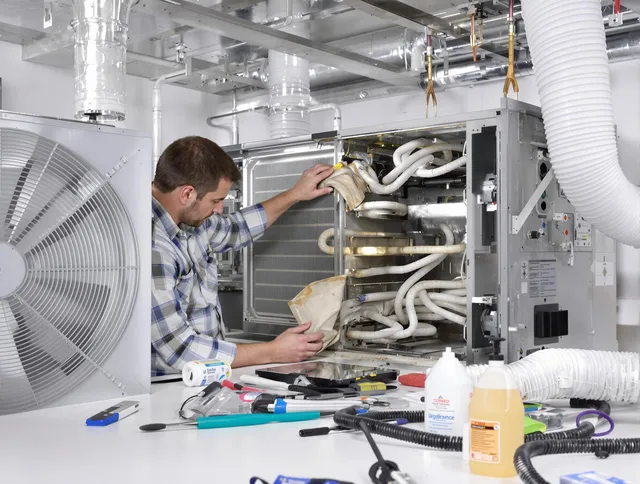 Maynard Air Duct Cleaning specialist performing precision AC coil cleaning in Maynard