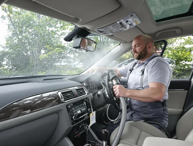 Maynard Air Duct Cleaning specialist performing professional car duct cleaning in Maynard