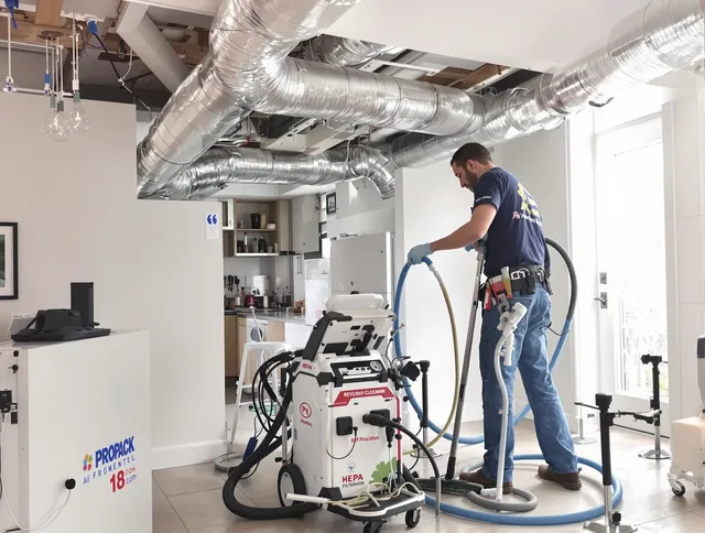 Maynard Air Duct Cleaning technician performing advanced pure duct cleaning with specialized equipment in Maynard